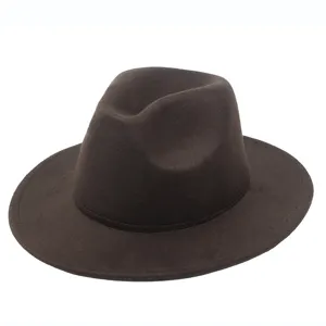 Detailed side view of a brown felt fedora hat showing texture and flat brim.