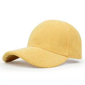 Macro view of yellow corduroy fabric on a classic baseball cap design