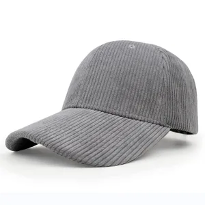 Detailed side view of a gray corduroy baseball cap with visible ribbed texture.