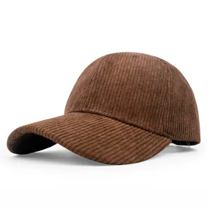 Detailed view of a brown corduroy baseball cap with a classic curved brim design.