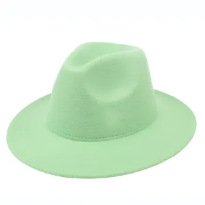 Detail of a mint green felt fedora hat with a flat wide brim on white background