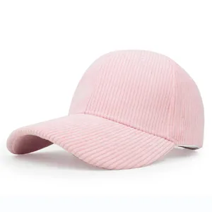 Detailed view of the pink corduroy texture on this plain curved brim baseball cap.