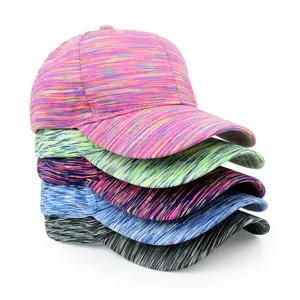 Vertical stack of colorful tie-dye baseball caps showing multiple vibrant color patterns.