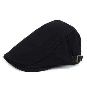 Side view of a classic black cotton flat cap with adjustable brass buckle detail.