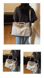 Detail showing the large capacity travel duffel bag with a shoulder strap for women