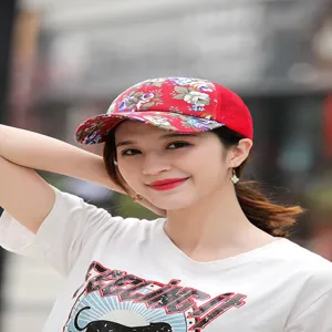 Close-up of a stylish women's floral mesh baseball cap with red visor for summer outdoor wear