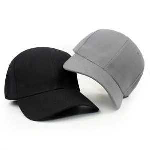Close-up of black and grey solid color blank baseball caps with curved brims.