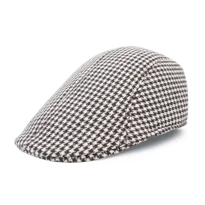 Close-up of classic black and white houndstooth pattern on a retro wool duckbill cap