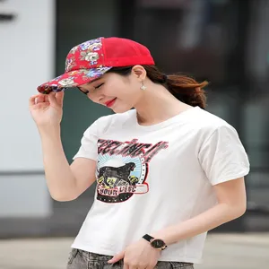 Asian woman wearing a stylish red floral mesh baseball cap for summer sun protection.