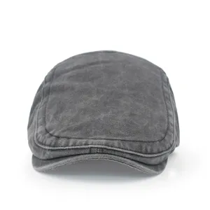 Frontal view of vintage washed grey cotton flat cap with distressed fabric texture