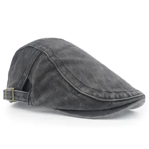 Detailed side view of a vintage washed cotton flat cap in dark grey with retro style