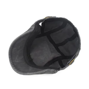 Inside view of a vintage washed cotton flat cap showing internal seams and lining