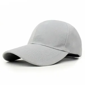 Detail of a plain light grey baseball cap with curved brim and twill fabric texture