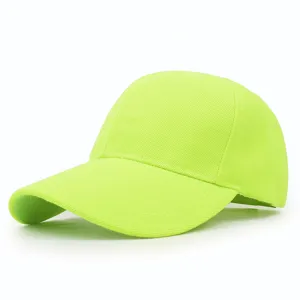 Macro view of neon green baseball cap showing textured fabric and curved brim design
