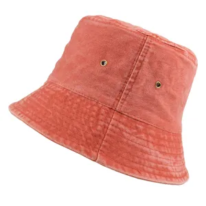 Side view detail of a washed denim bucket hat in orange-red for outdoor sun protection