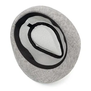 Detail view showing breathable mesh interior and washing label of a summer trilby hat.