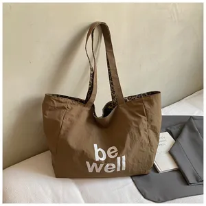 Casual brown canvas tote bag with leopard lining and be well print