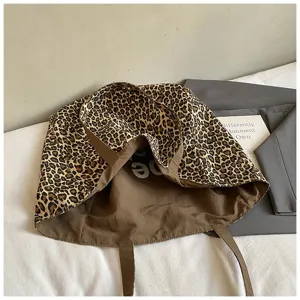 Detailed view of the interior and leopard print pattern of a large canvas tote bag