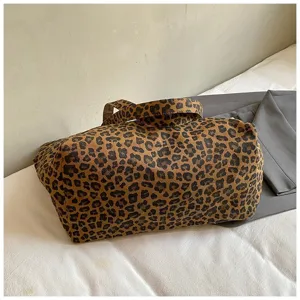 Large capacity leopard print canvas tote bag shown in a casual lifestyle setting