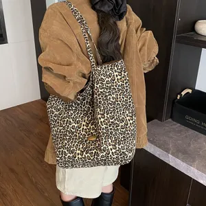 Leopard print canvas tote bag on female model with corduroy jacket