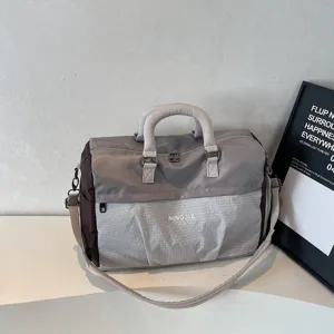 Large capacity gray nylon travel duffel bag with shoulder strap for fitness and weekend trips