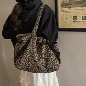 Casual leopard print canvas tote bag with large capacity shown in a lifestyle scene