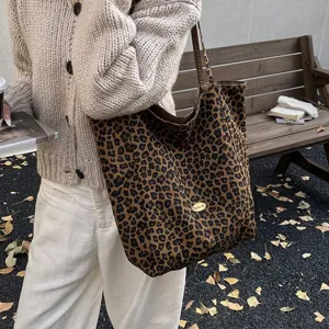 Stylish large leopard print canvas tote bag carried by model in autumnal outdoor setting