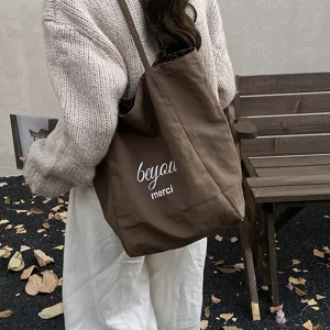 Large brown double-sided canvas tote bag with leopard print lining and merci print