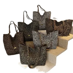 Various leopard print canvas tote bags featuring large capacity and stylish leopard patterns