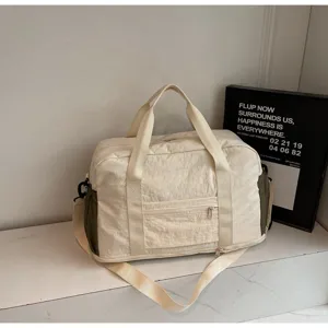 Lightweight cream white sports travel bag with olive green side accents for gym use