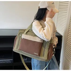 Model carrying a stylish tri-color dry-wet separation gym bag in a modern interior setting