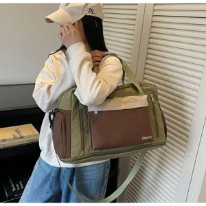 Green and brown travel gym bag with dry-wet separation features and adjustable shoulder strap