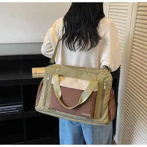Large dry-wet separation travel duffel bag shown on model with multi-color design