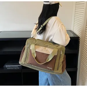 Side profile of an olive and brown travel bag featuring dry-wet separation design