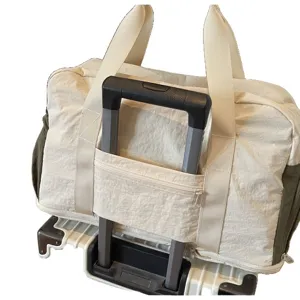 Versatile large capacity travel duffel bag with trolley sleeve mounted on suitcase handle