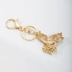 Elegant gold-plated parrot on flower branch keychain featuring lobster clasp and split ring