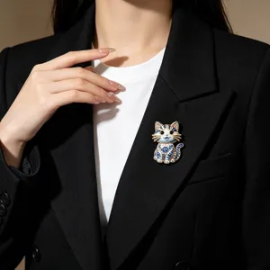 Elegant blue and white porcelain cat brooch pin on black blazer accessory for women