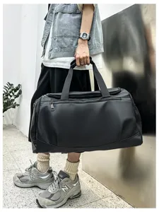 Grand sac de sport noir grande capacité, idéal pour l'entraînement fitness et voyage.
