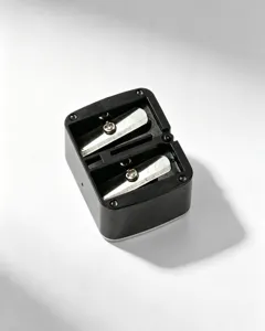 Professional top view of a black double-hole manual sharpener for pencils and cosmetics