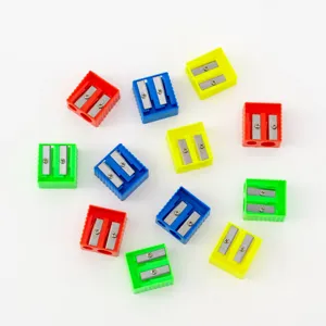 Colorful plastic dual hole pencil sharpeners detail view, bulk school stationery set.