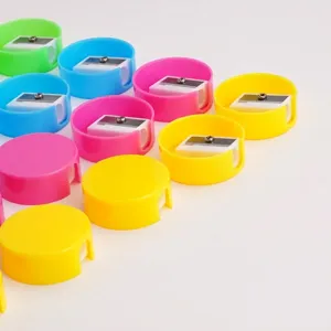 Colorful round mini manual pencil sharpeners for students in vibrant pink, blue, yellow, green.