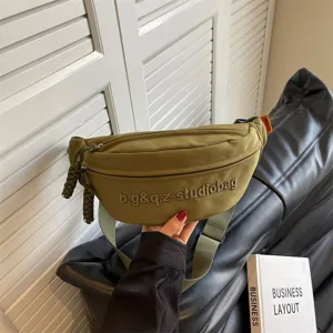 Minimalist olive green crossbody chest bag with studio logo embroidery for sports