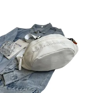 Minimalist white multifunctional chest bag with embroidered text for casual sports use