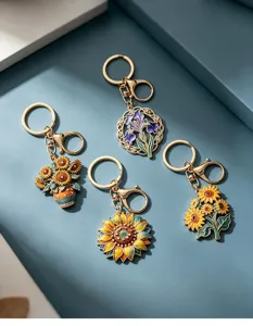 Set de 4 llaveros de esmalte inspirados en Van Gogh con diseños de girasoles e iris