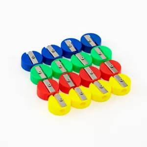Macro view of colorful mini round single-hole pencil sharpeners on white background