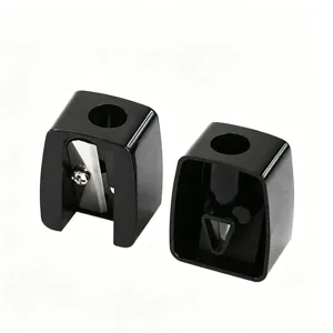 Detail view of black mini single-hole sharpeners for eyebrow and lip makeup pencils.