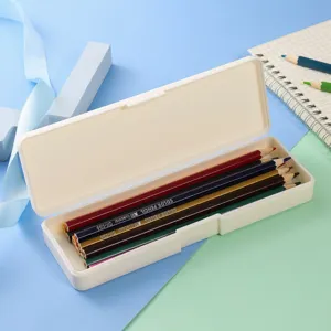 Detailed close-up showing the interior of a minimalist cream PP plastic pencil box with pencils
