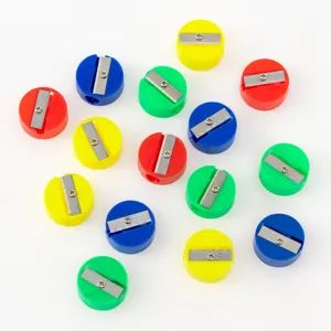 Collection of various colorful mini round pencil sharpeners featuring single-hole design