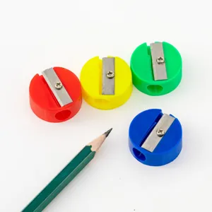 Detailed view of mini round single-hole pencil sharpeners in four vibrant colors.