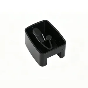 Macro view of the internal blade and reservoir of a black makeup pencil sharpener